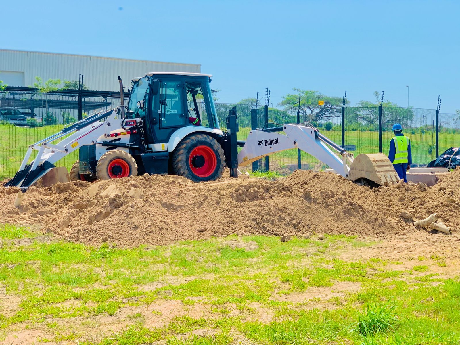 Bobcat TLB excavating a services trench