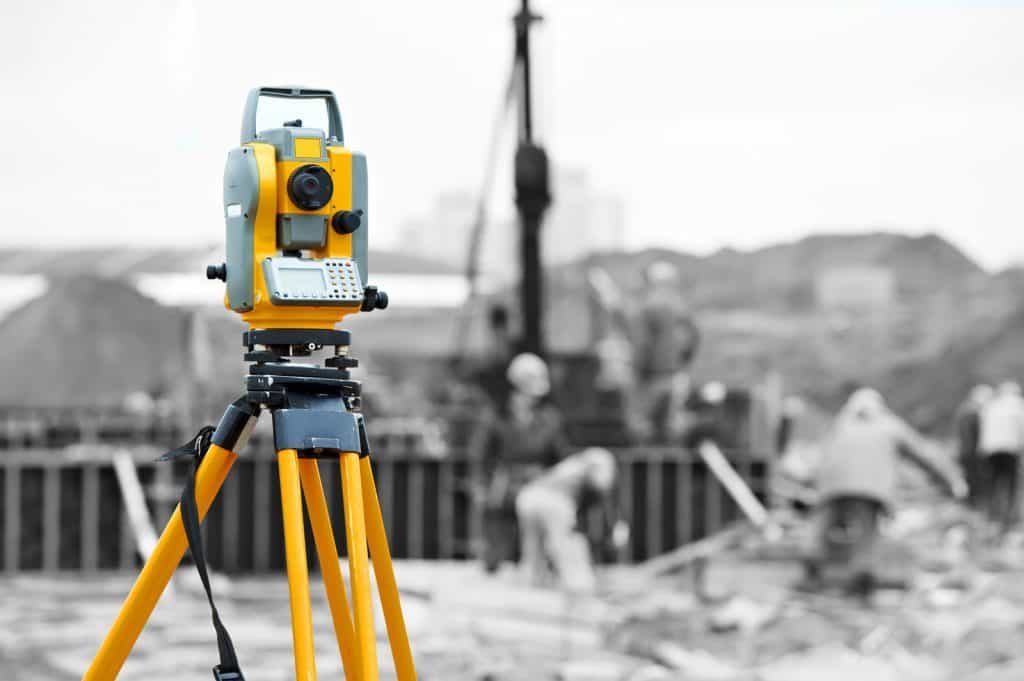 Total station survey instrument set up on a construction site